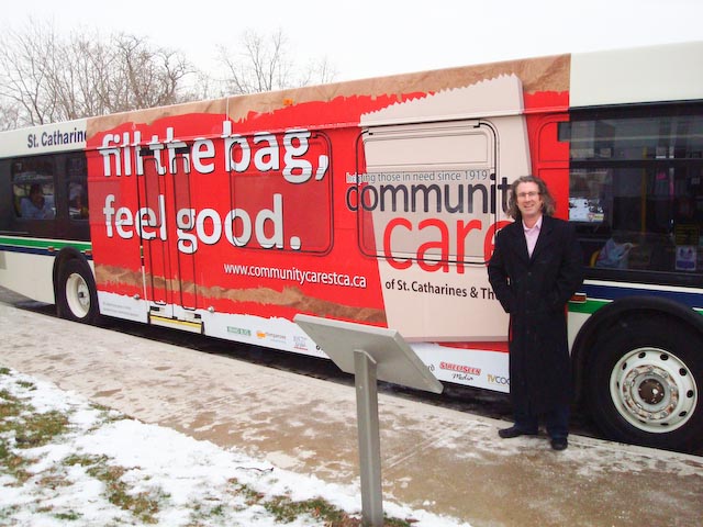 Timothy in front of St. Catharines Transit bus in 2011